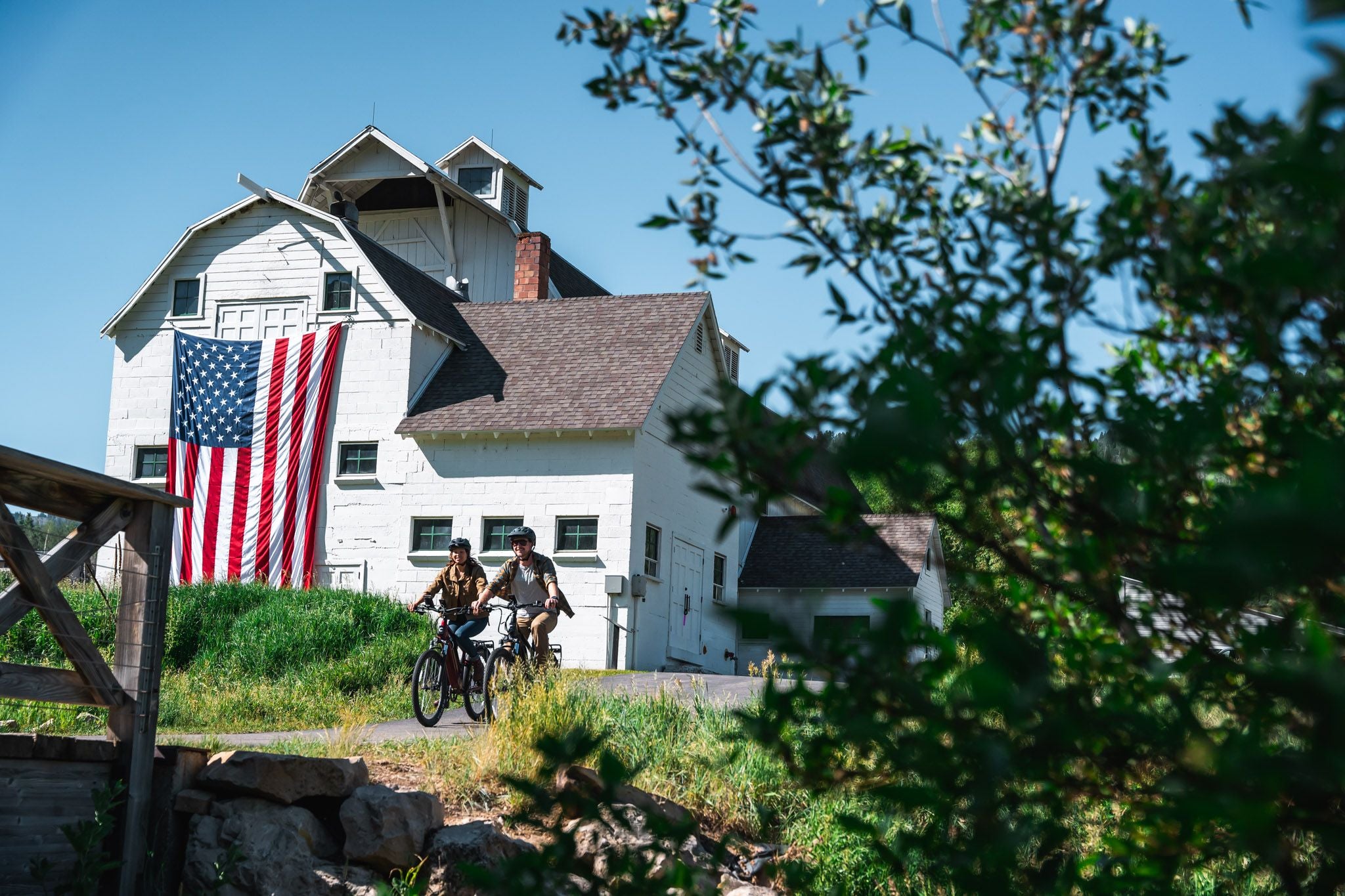 Couple riding electric bike rentals around park city from Switchback Sports